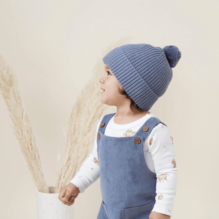 Close-Up-of-Child-Wearing-Aster-and-Oak-Organic-Cotton-PomPom-Beanie-Navy-Naked-Baby-Eco-Boutique