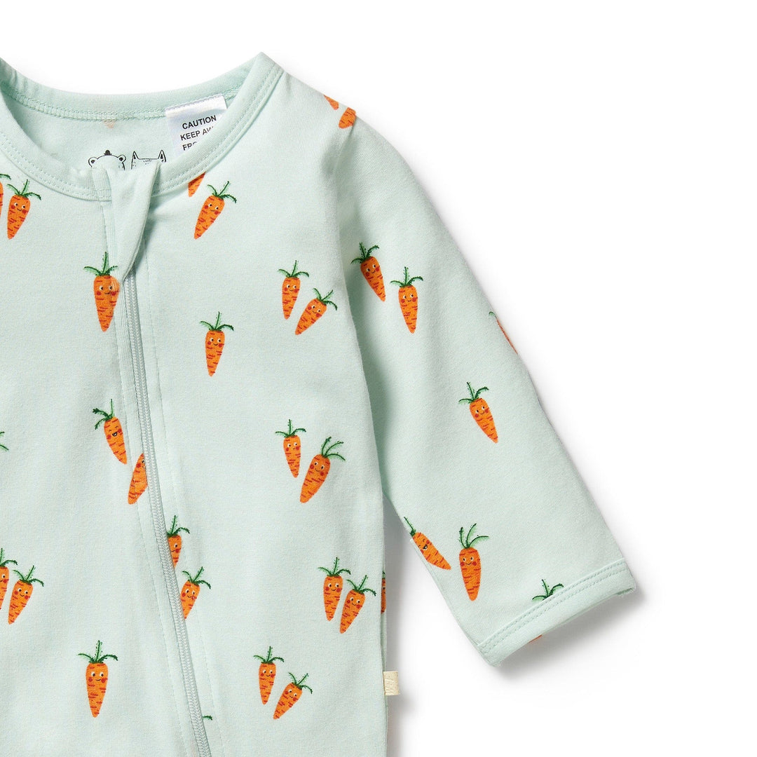 A Wilson & Frenchy Organic Baby Easter Pyjamas with carrots on it, ready for snuggle time.
