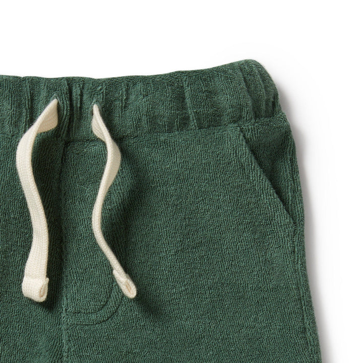 A baby's Wilson & Frenchy Organic Terry Shorts (Multiple Variants) with a white drawstring.