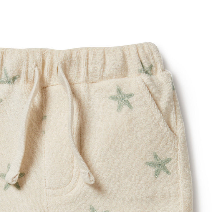 Wilson & Frenchy Organic Terry Shorts adorned with stars for a baby boy.