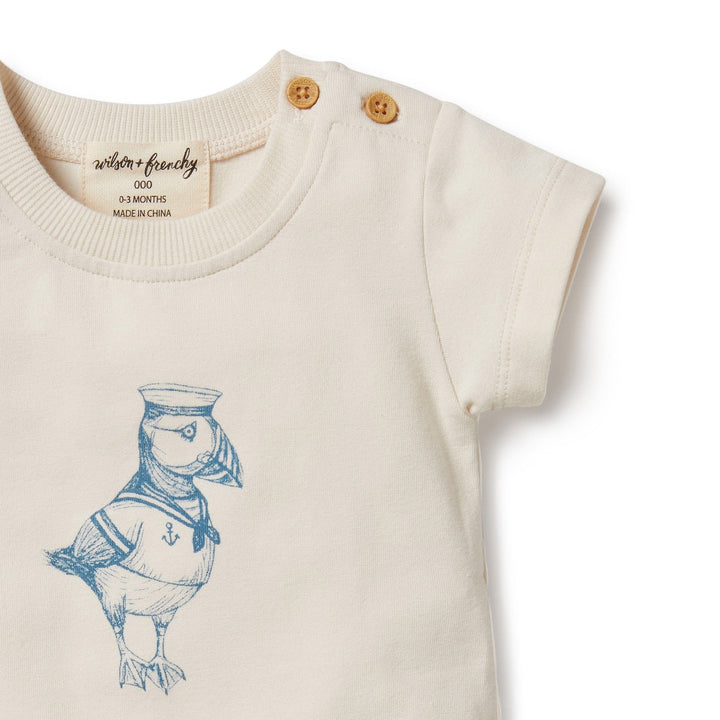 An Wilson & Frenchy organic baby t-shirt with a sailor illustration.