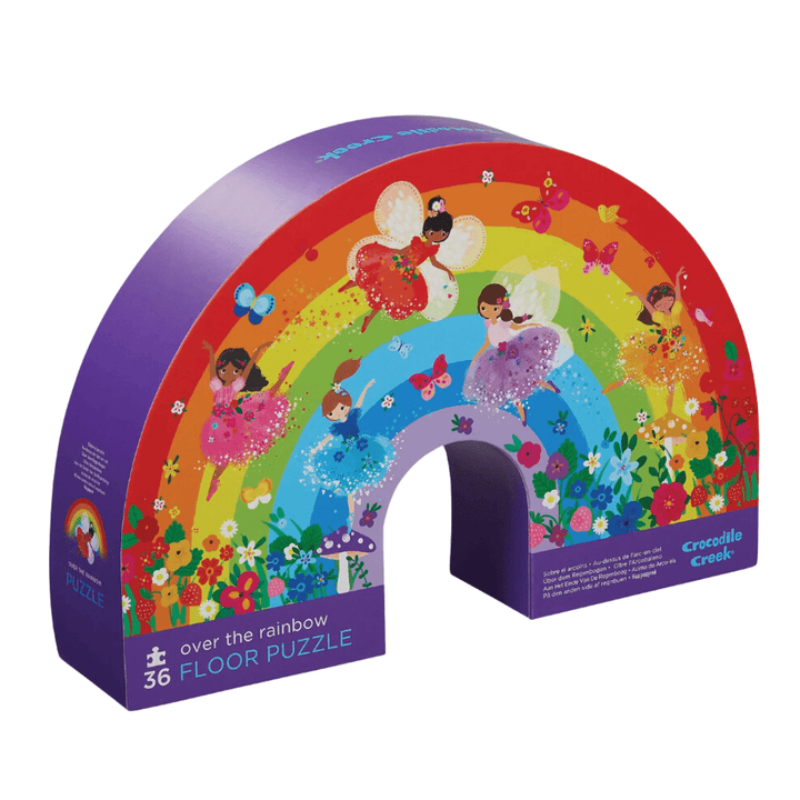 A Crocodile Creek 36-Piece Floor Puzzle featuring a rainbow-shaped jigsaw box adorned with delightful fairies.