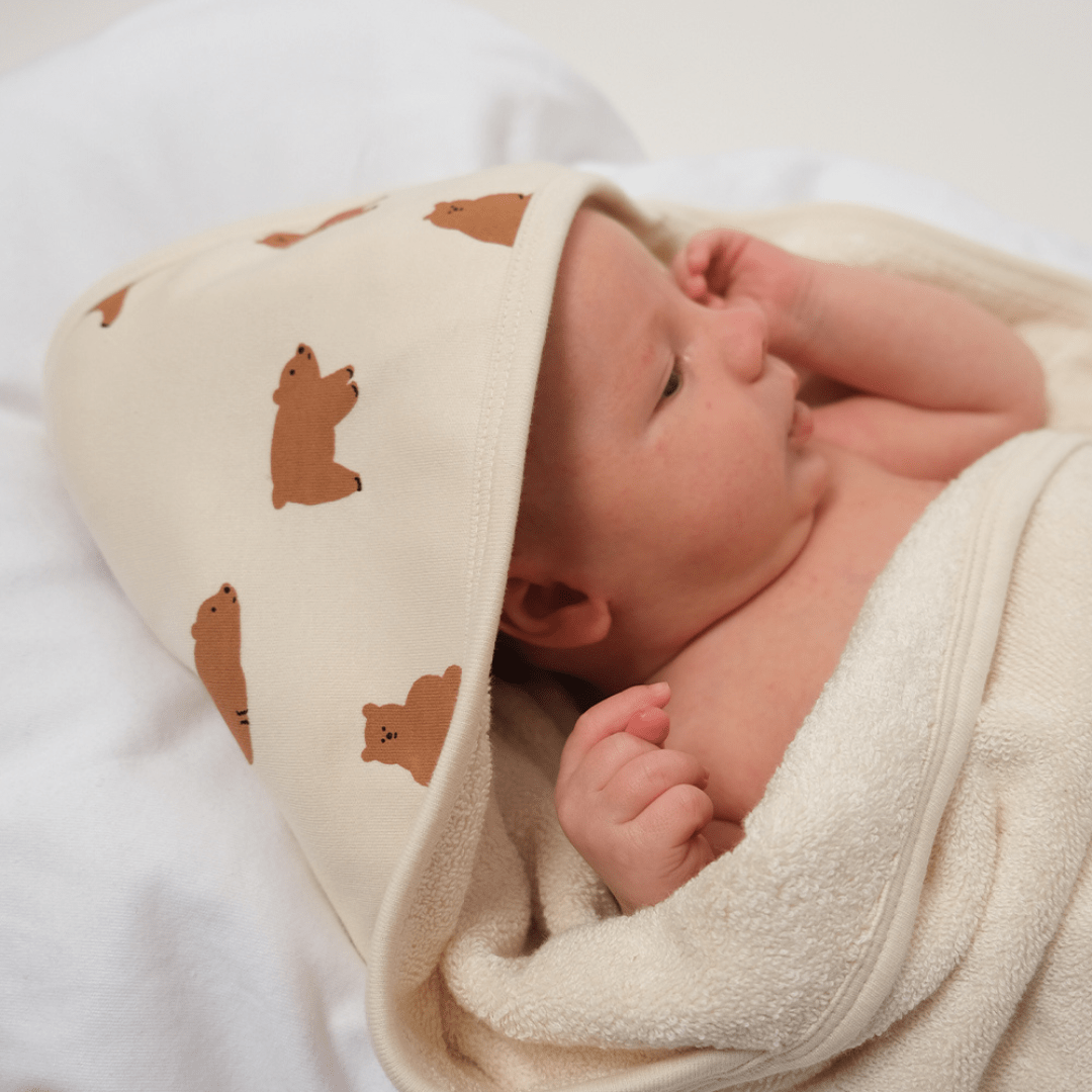Cute-Baby-Lying-Wrapped-inBabu-Printed-Organic-Organic-Hooded-Baby-Towel-Chubby-Bear-Naked-Baby-Eco-Boutique