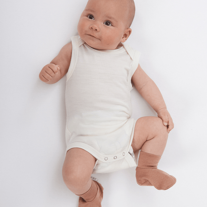 Cute-Baby-in-Booties-Wearing-Babu-Merino-Wool-Singlet-Onesie-Naked-Baby-Eco-Boutique