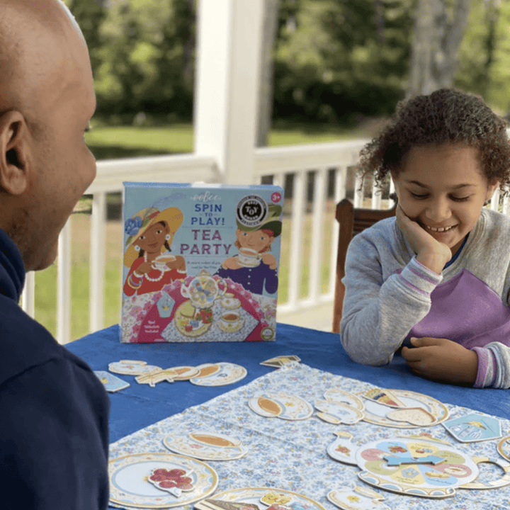 Dad-And-Daughter-Playing-Eeboo-Spin-To-Play-Game-Tea-Party-Naked-Baby-Eco-Boutique