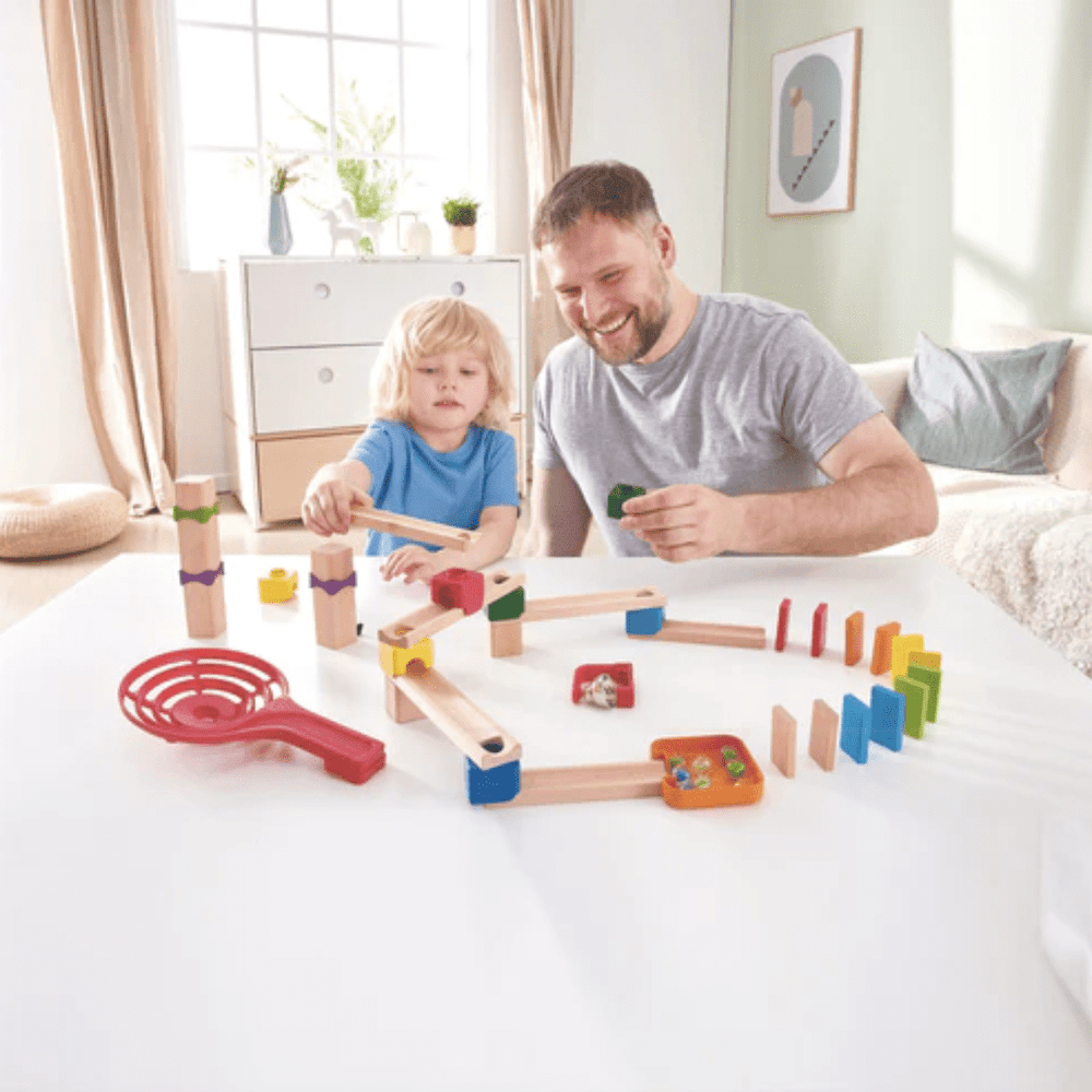 Dad-And-Son-Setting-Up-Track-Together-Hape-Marble-Domino-Rally-Block-Set-Naked-Baby-Eco-Boutique