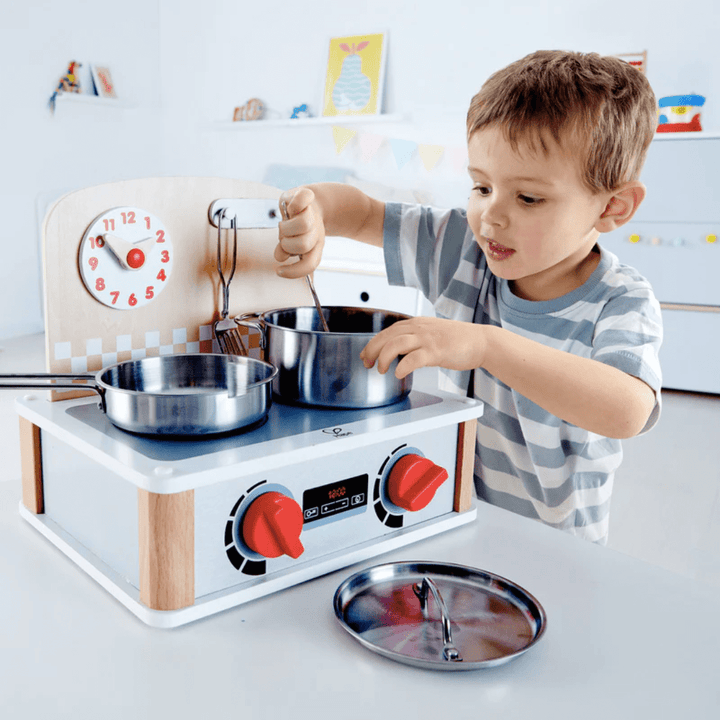 Happy-Boy-Cooking-With-Hape-2-In-1-Kitchen-And-Grill-Set-Naked-Baby-Eco-Boutique