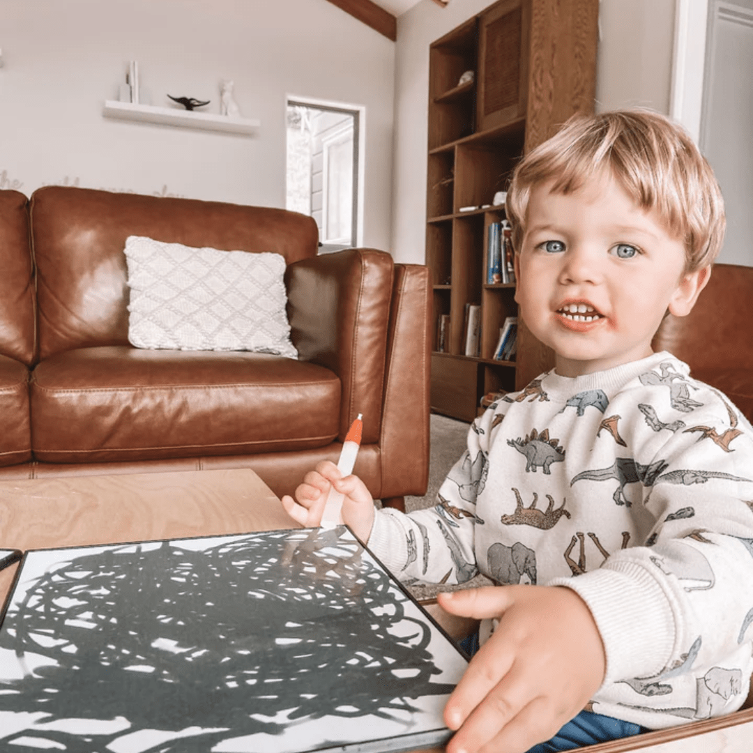 Happy-Boy-Painting-With-Zazi-Magic-Water-Painting-Board-And-Pens-Naked-Baby-Eco-Boutique
