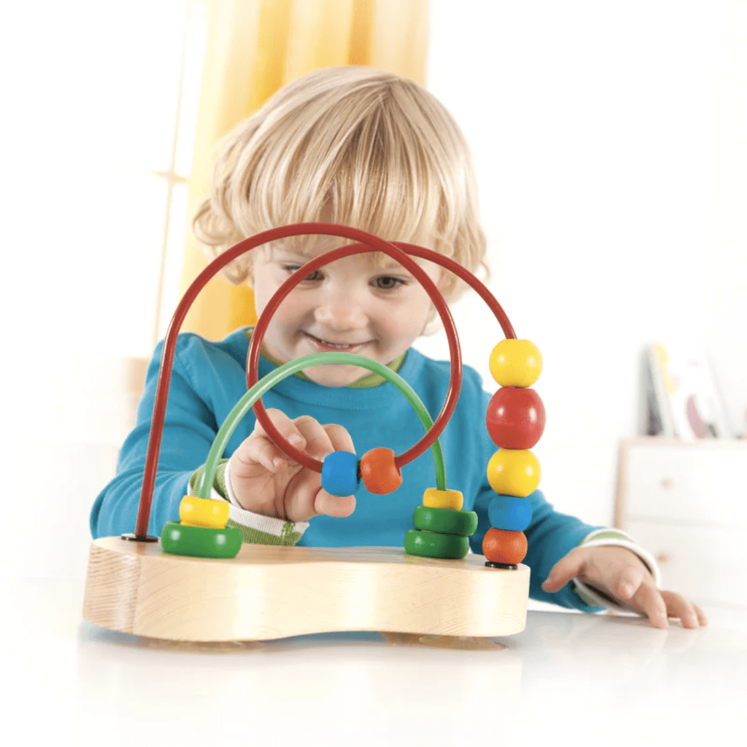 Happy-Boy-Playing-With-Hape-Double-Bubble-Bead-Maze-Naked-Baby-Eco-Boutique