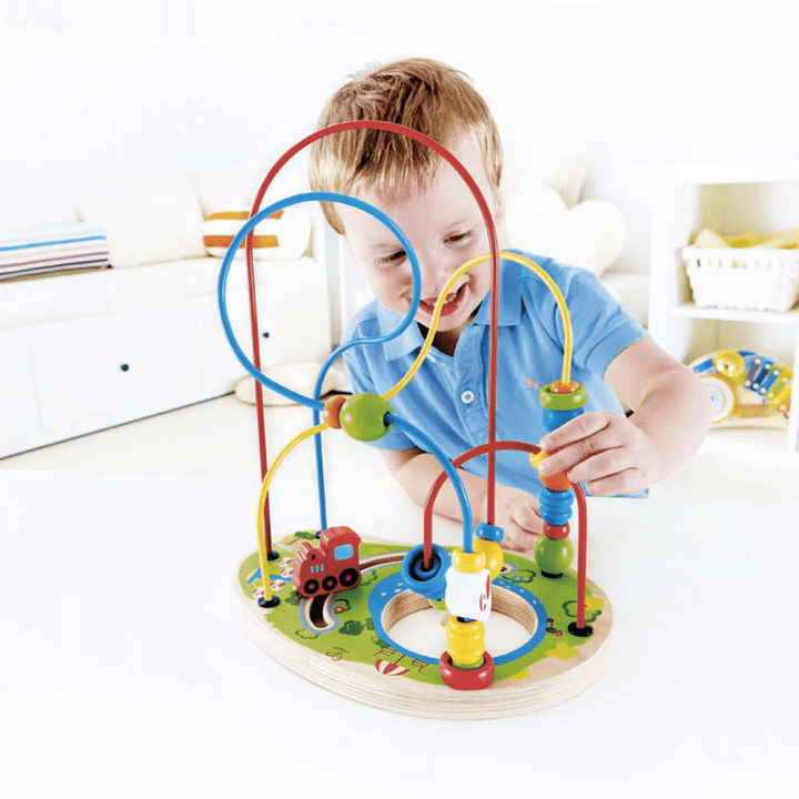 Happy-Boy-Playing-With-Hape-Playground-Pizzaz-Naked-Baby-Eco-Boutique