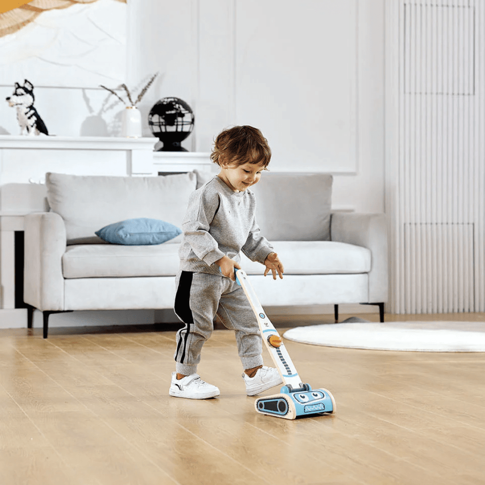 Happy-Boy-Tidying-House-With-Hape-Robot-Vacuum-Machine-Naked-Baby-Eco-Boutique