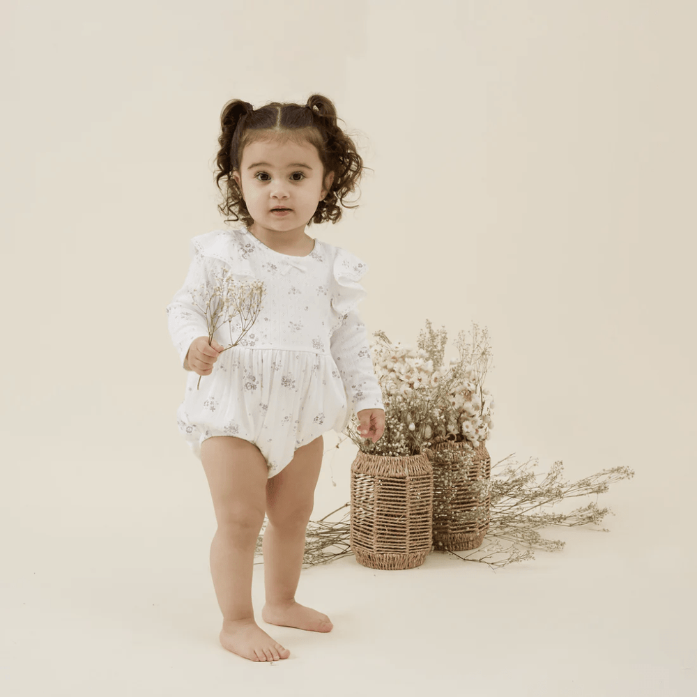 Happy-Gir_-Wearing-Aster-And-Oak-Organic-Grace-Floral-Bubble-Romper-Naked-Baby-Eco-Boutique