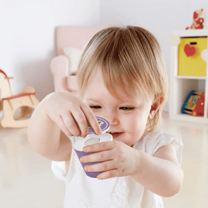 Happy-Girl-Opening-Yoghurt-In-Hape-Delicious-Breakfast-Playtime-Set-Naked-Baby-Eco-Boutique