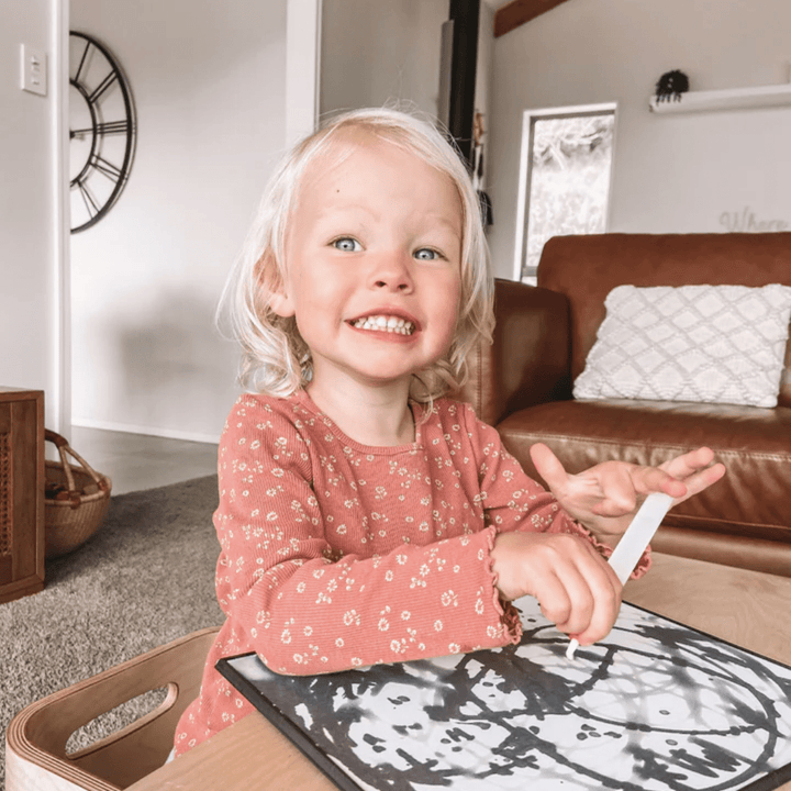 Happy-Girl-Painting-With-Zazi-Magic-Water-Painting-Board-And-Pens-Naked-Baby-Eco-Boutique
