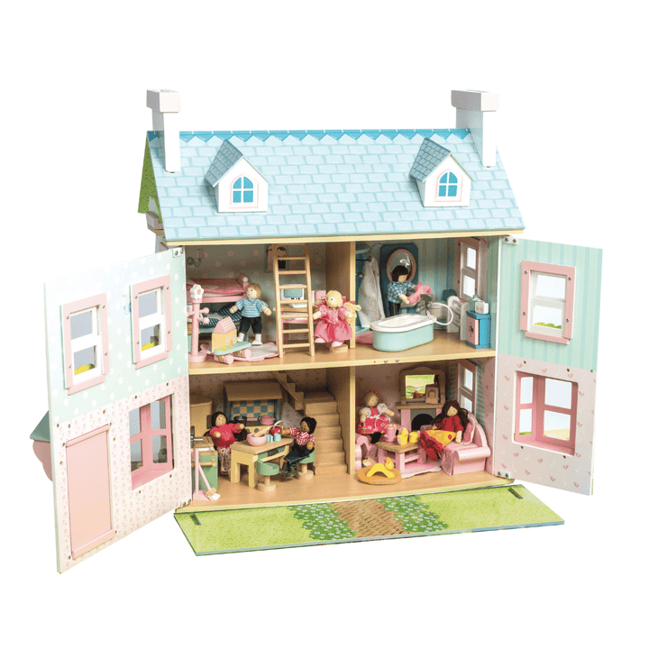 A Le Toy Van Mayberry Manor Dollhouse made of solid rubberwood with people in it.