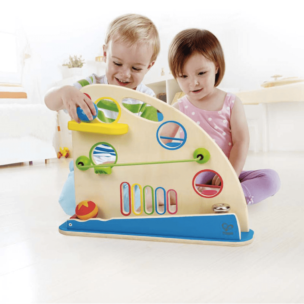 Kids-Playing-Together-Roller-Balls-With-Hape-Roller-Derby-Naked-Baby-Eco-Boutique
