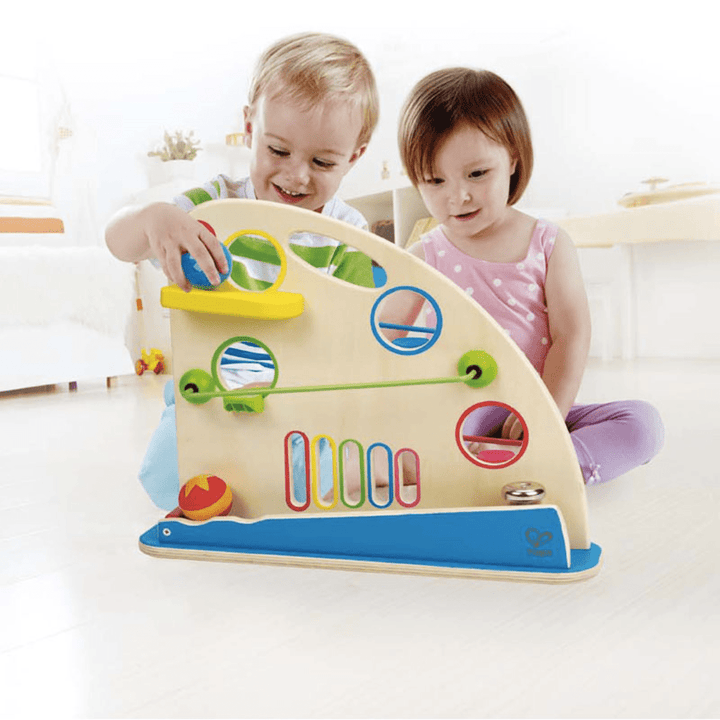 Kids-Playing-Together-Roller-Balls-With-Hape-Roller-Derby-Naked-Baby-Eco-Boutique