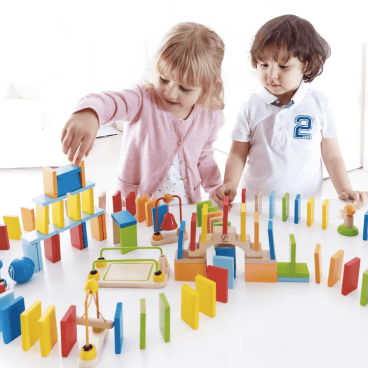 Kids-Playing-Together-With-Hape-Dynamo-Dominoes-Naked-Baby-Eco-Boutique