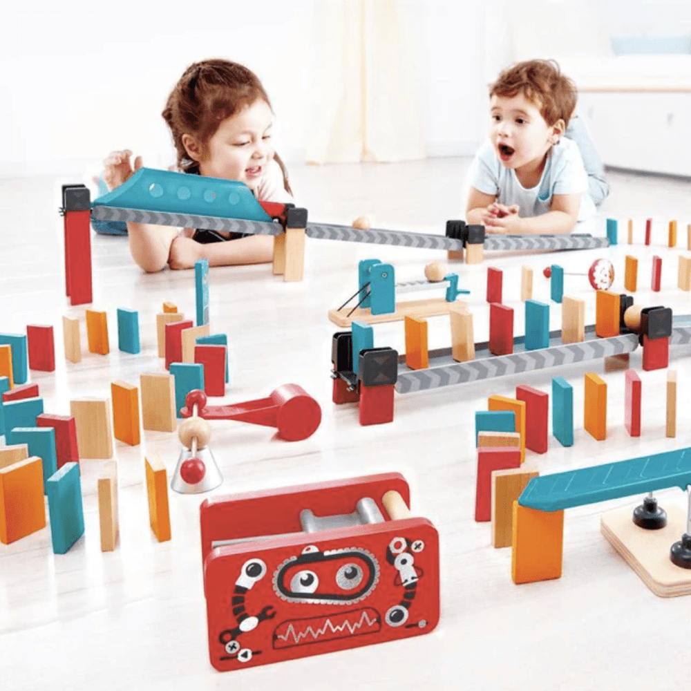 Kids-Playing-Together-With-Hape-Robot-Factory-Dominoes-Naked-Baby-Eco-Boutique