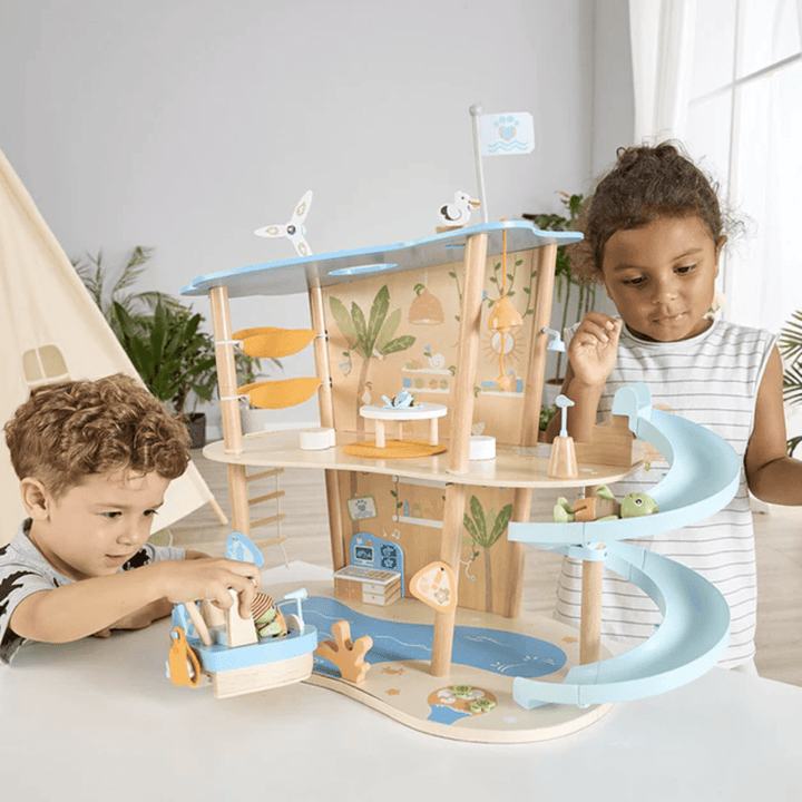 Kids-Playing-With-Boat-And-Turtle-On-Slide-In-Hape-Green-Planet-Ocean-Rescue-Beach-House-Naked-Baby-Eco-Boutique