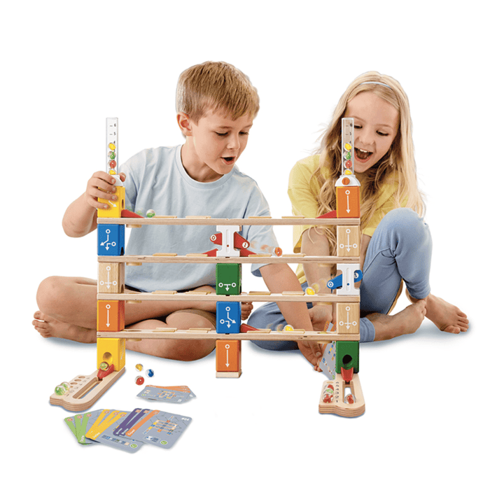 Kids-Setting-Up-Marble-Run-Together-Hape-Quadrilla-Marble-Run-Basic-Coding-Set-Naked-Baby-Eco-Boutique