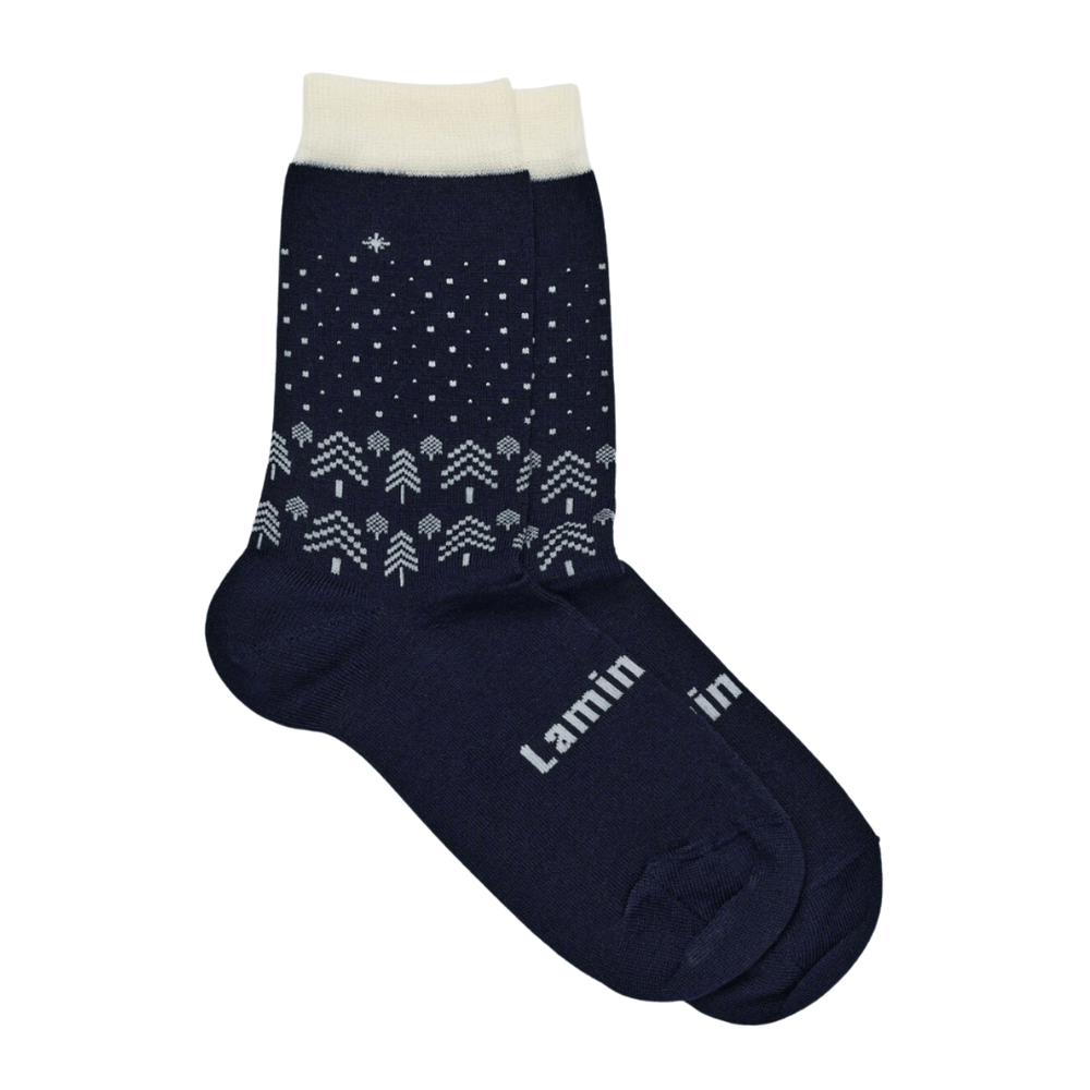 A pair of Lamington Merino Wool Christmas Socks - Crew - Comet - LUCKY LAST - 4-6 YEARS, featuring snowflakes, perfect for the Lamington Christmas edition.