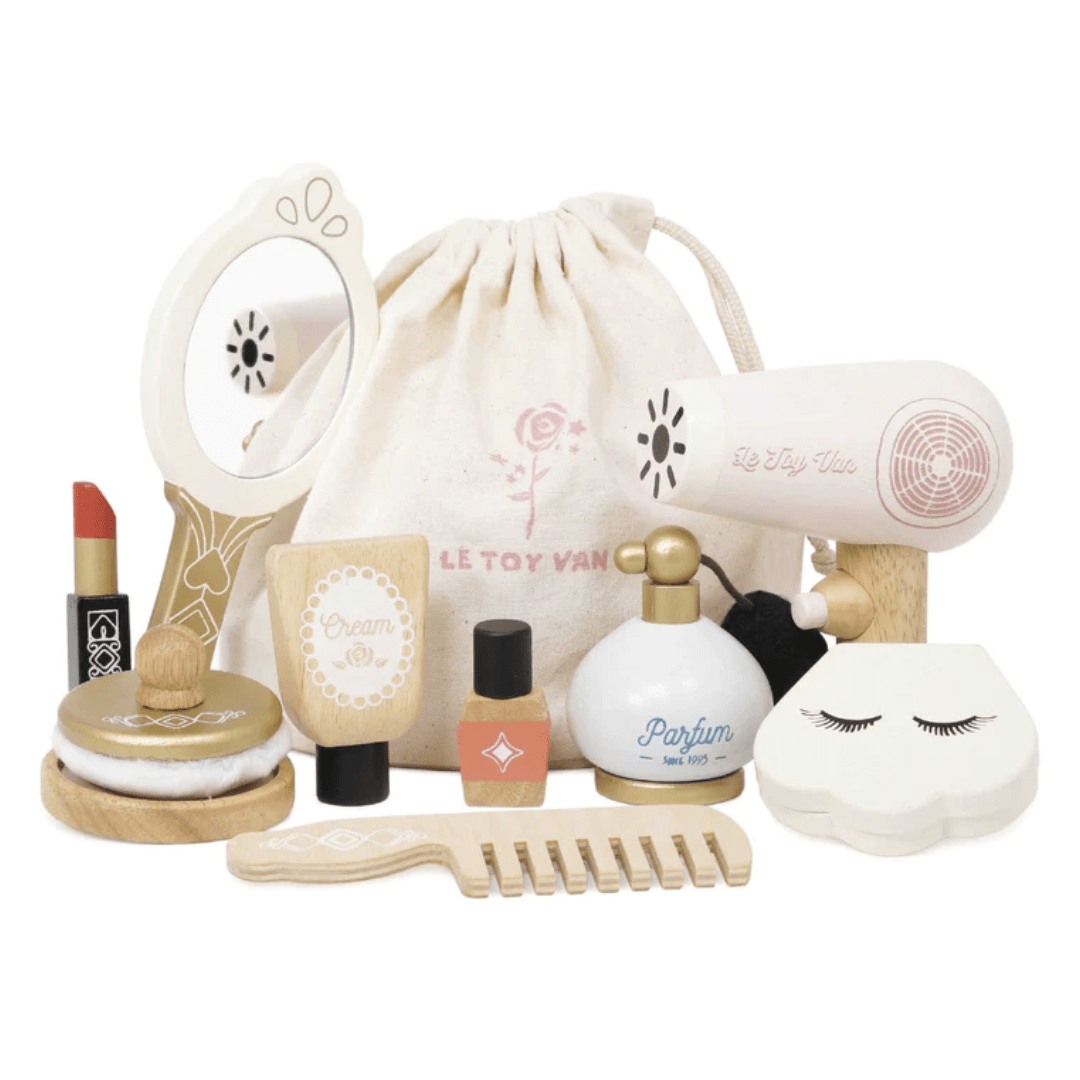 A collection of Le Toy Van Star Beauty Bag - LUCKY LAST wooden pretend makeup set and beauty accessories for children.