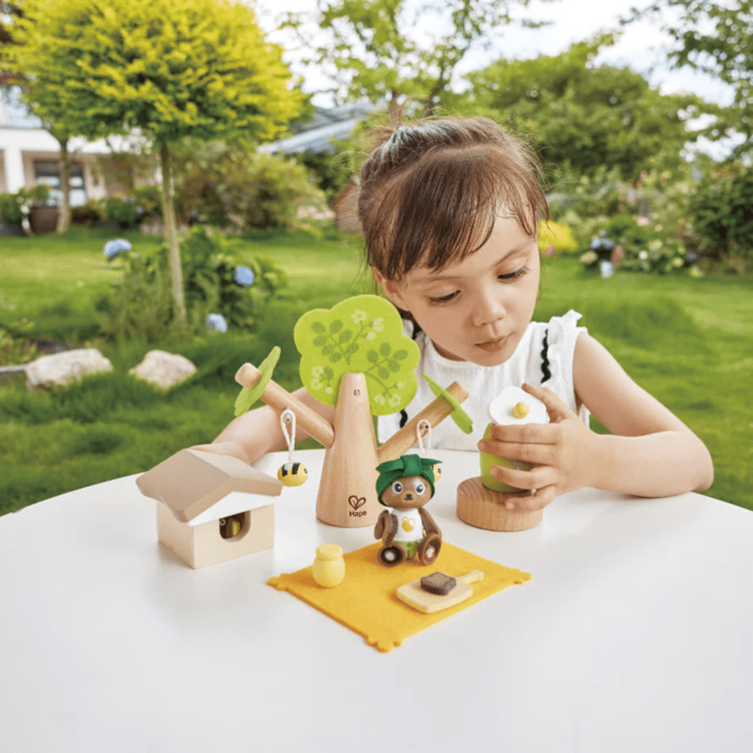 Litlle-Girl-With-Honey-Pot-In-Hape-Green-Planet-Bee-And-Honey-Set-Naked-Baby-Eco-Boutique