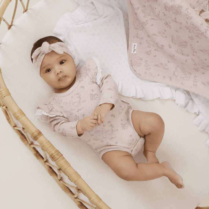 Little-Baby-In-Bassinet-Wearing-Aster-And-Oak-Duck-Family-Flutter-Onesie-And-Matching-Headband-Naked-Baby-Eco-Boutique