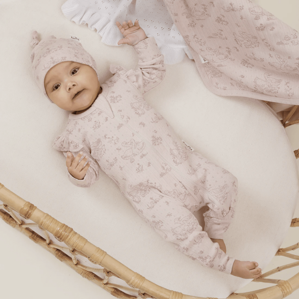 Little-Baby-In-Bassinet-Wearing-Aster-And-Oak-Organic-Duck-Family-Zip-Romper-Naked-Baby-Eco-Boutique