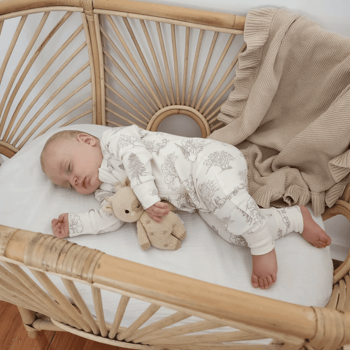 Little-Baby-In-Bassinet-Wearing-Aster-And-Oak-Organic-Long-Sleeved-Zip-Romper-Fox-Woods-Naked-Baby-Eco-Boutique