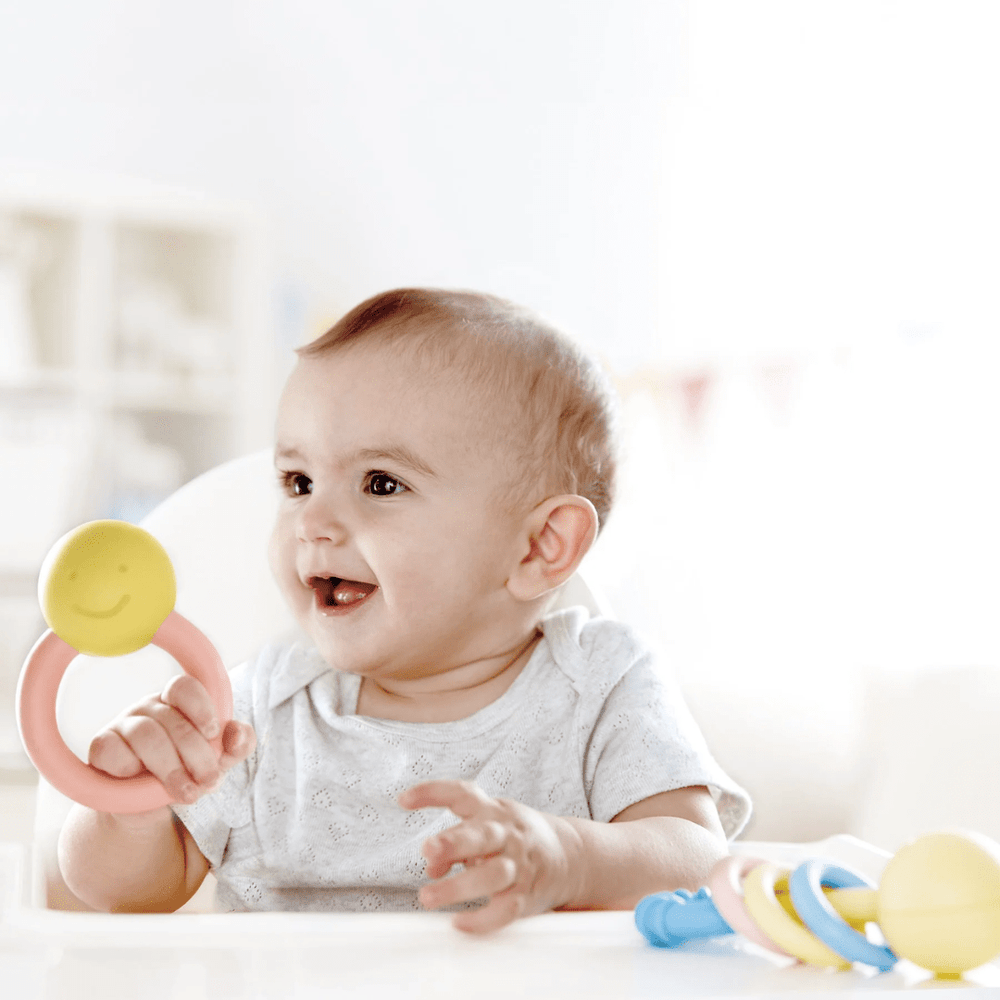 Little-Baby-Playing-With-Hape-Ring-Rattle-Naked-Baby-Eco-Boutique