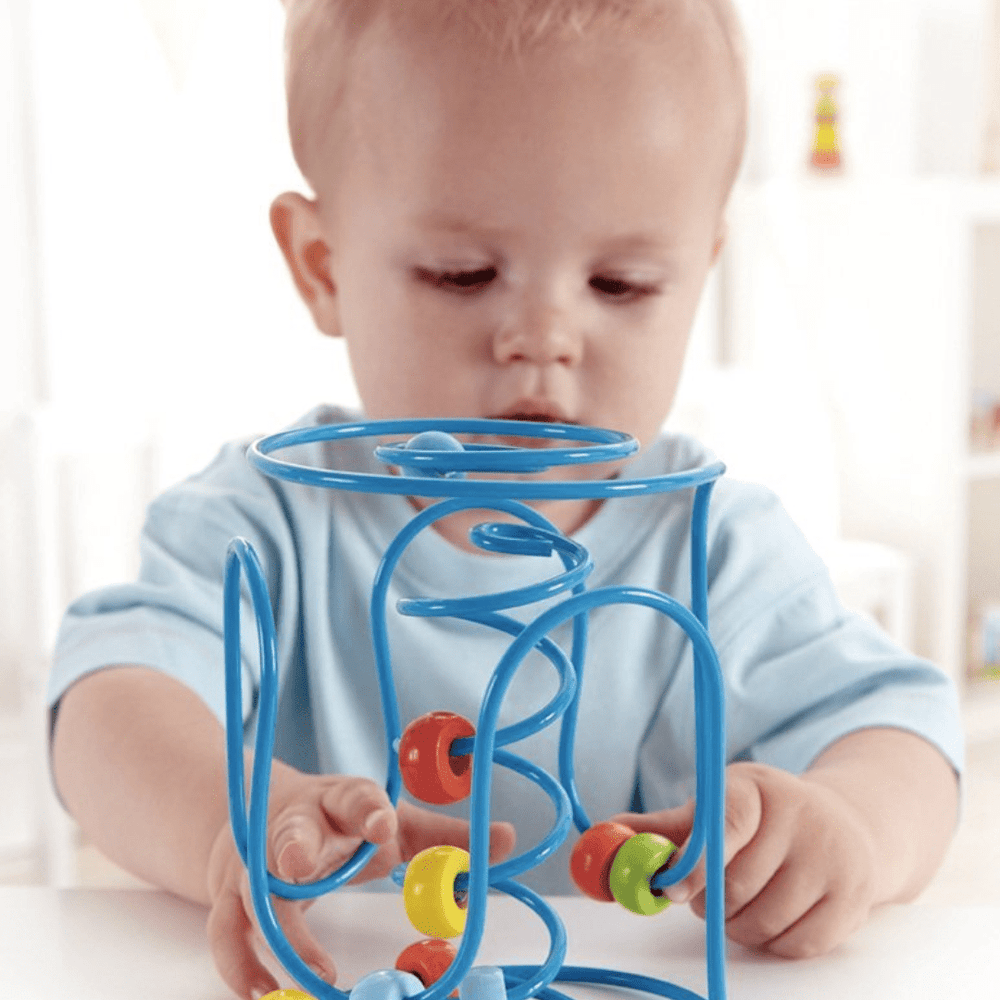 Little-Baby-Playing-With-Hape-Spring-A-Long-Bead-Maze-Naked-Baby-Eco-Boutique