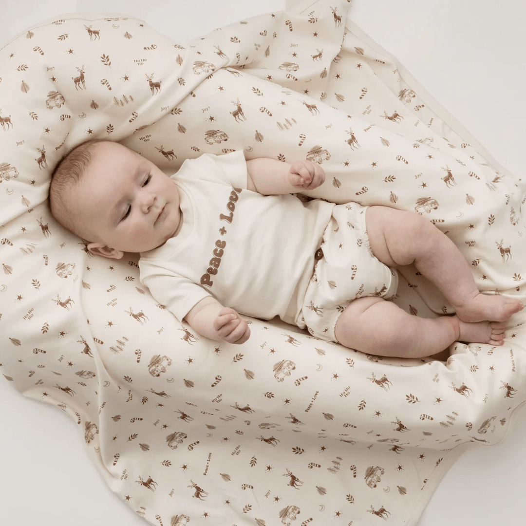 Little-Baby-Wearing-Aster-And-Oak-Organic-Peace-And-Love-Print-Tee-Naked-Baby-Eco-Boutique-On-Bed