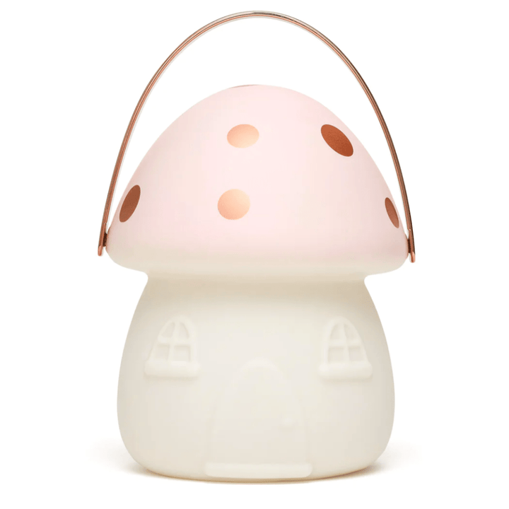 A Little Belle Nightlights Fairy House Carry Lantern with polka dots, perfect for illuminating the nighttime ambiance in a fairy house.