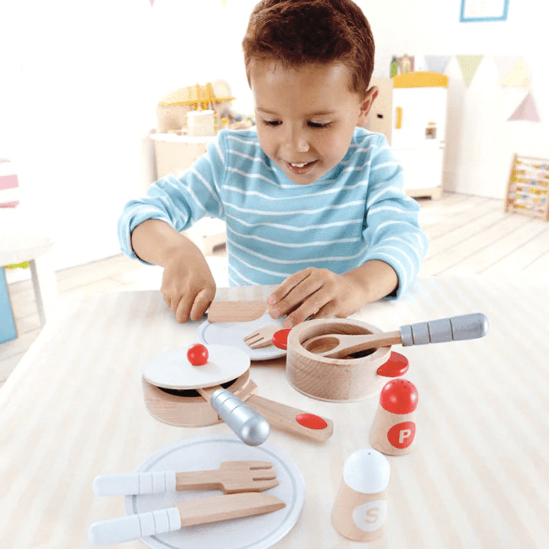 Little-Boy-Cutting-With-Hape-Cook-And-Serve-Set-Naked-Baby-Eco-Boutique