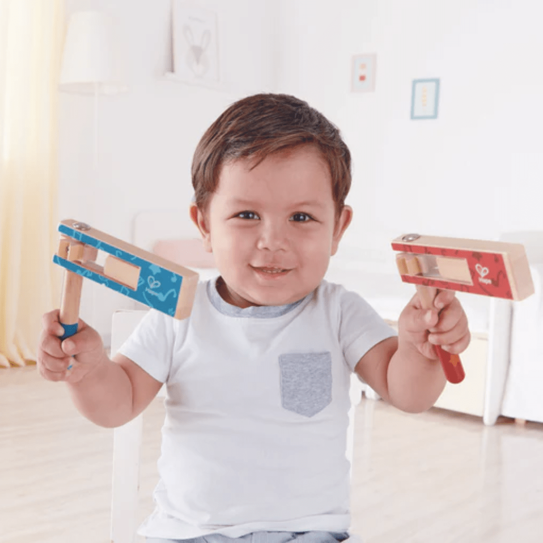 Little-Boy-Holding-Hape-Cheer-A-Long-Noisemaker-Naked-Baby-Eco-Boutique