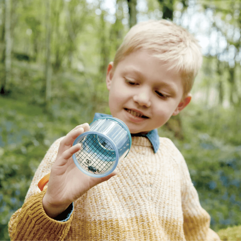 Little-Boy-Inspecting-Bug-In-Hape-Explorers-Bug-Jar-Naked-Baby-Eco-Boutique