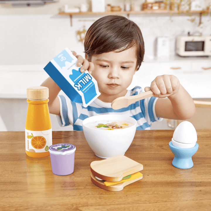 Little-Boy-Playing-With-Hape-Delicious-Breakfast-Playtime-Set-Naked-Baby-Eco-Boutique