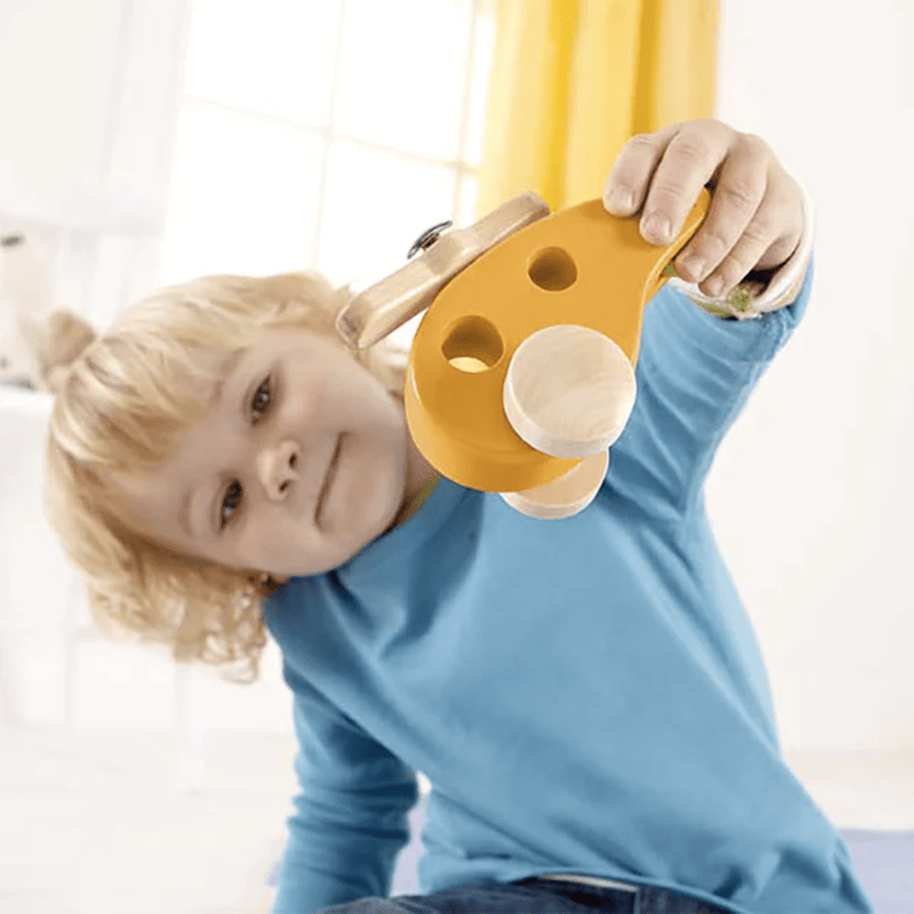 Little-Boy-Playing-With-Hape-Little-Helicopter-Naked-Baby-Eco-Boutique