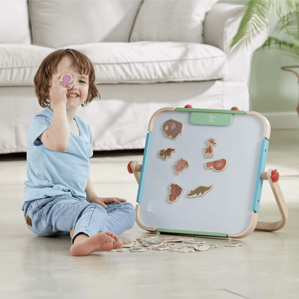 Little-Boy-Playing-With-Hape-Magnetic-Animals-Naked-Baby-Eco-Boutique