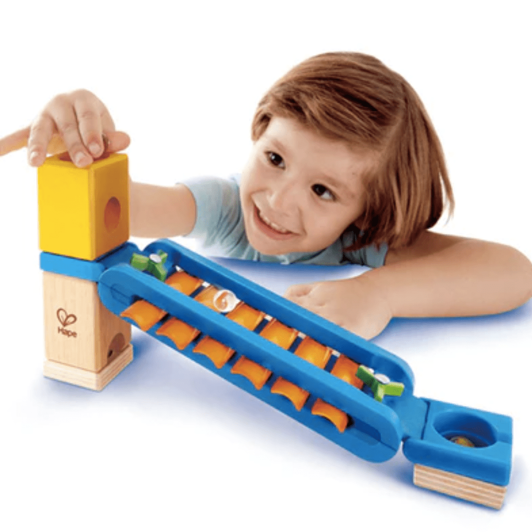 Little-Boy-Playing-With-Hape-Quadrilla-Marble-Run-Sonic-Playground-Naked-Baby-Eco-Boutique