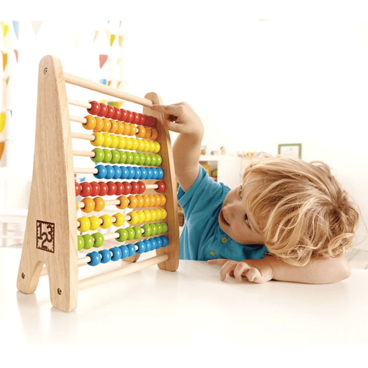 Little-Boy-Playing-With-Hape-Rainbow-Bead-Abacus-Naked-Baby-Eco-Boutique