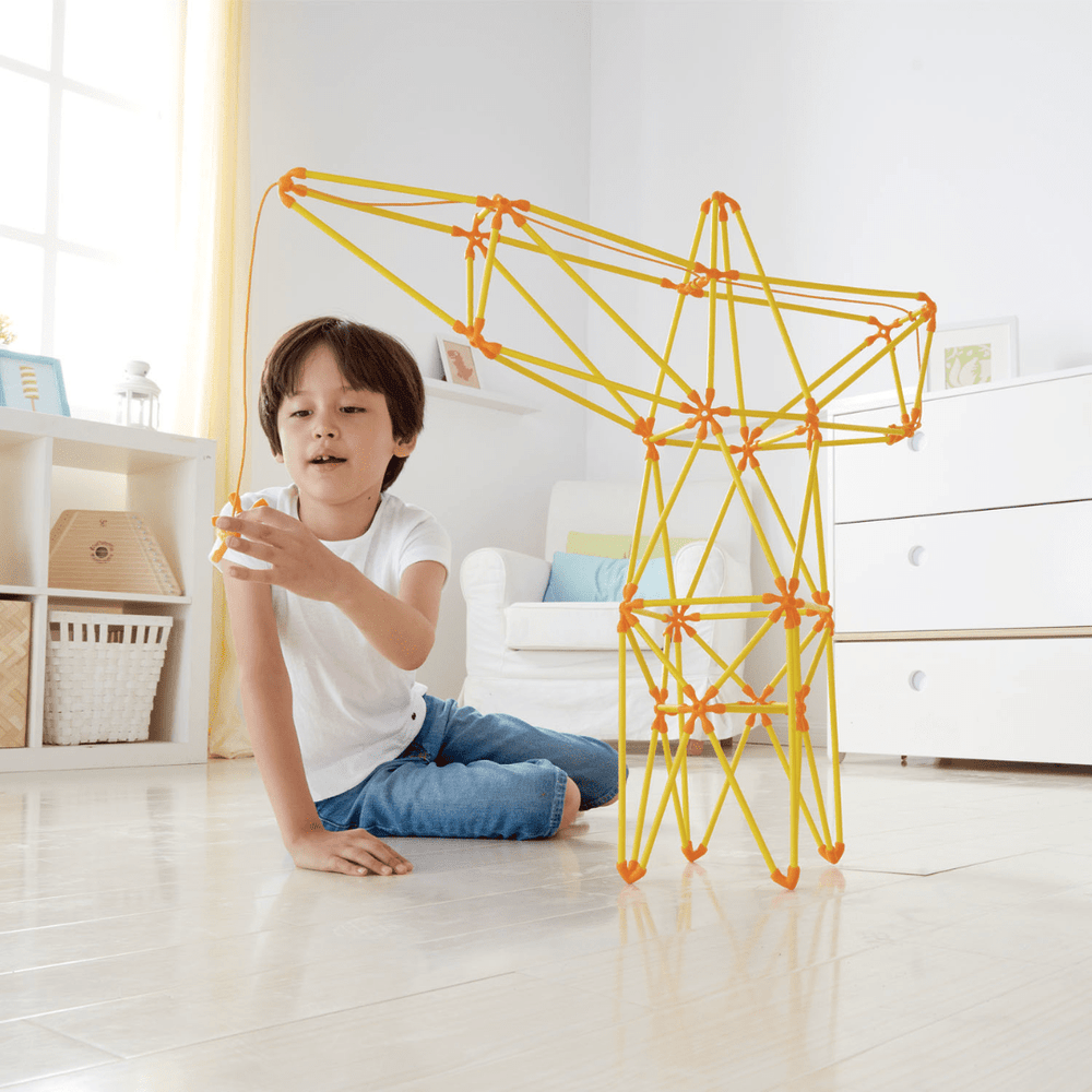 Little-Boy-Playing-With-Hape-Truss-Crane-Naked-Baby-Eco-Boutique