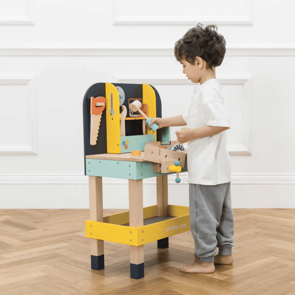 Little-Boy-Playing-With-Le-Toy-Van-Alexs-Work-Bench-Naked-Baby-Eco-Boutique