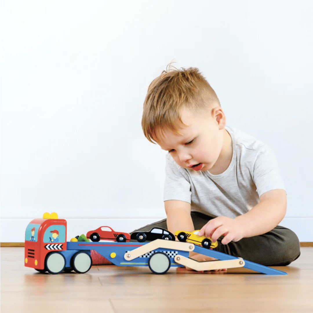 Little-Boy-Playing-With-Le-Toy-Van-Race-Car-Transporter-Set-Naked-Baby-Eco-Boutique