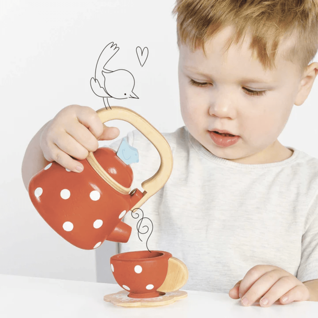 Little-Boy-Pouring-A-Drink-With-Le-Toy-Van-Dotty-Kettle-Naked-Baby-Eco-Boutique