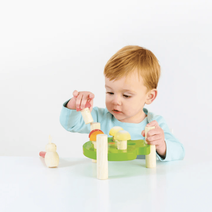 Little-Boy-Putting-Mushroom-In-The-Base-On-Le-Toy-Van-Mr-Mushroom-Hammer-Game-Naked-Baby-Eco-Boutique