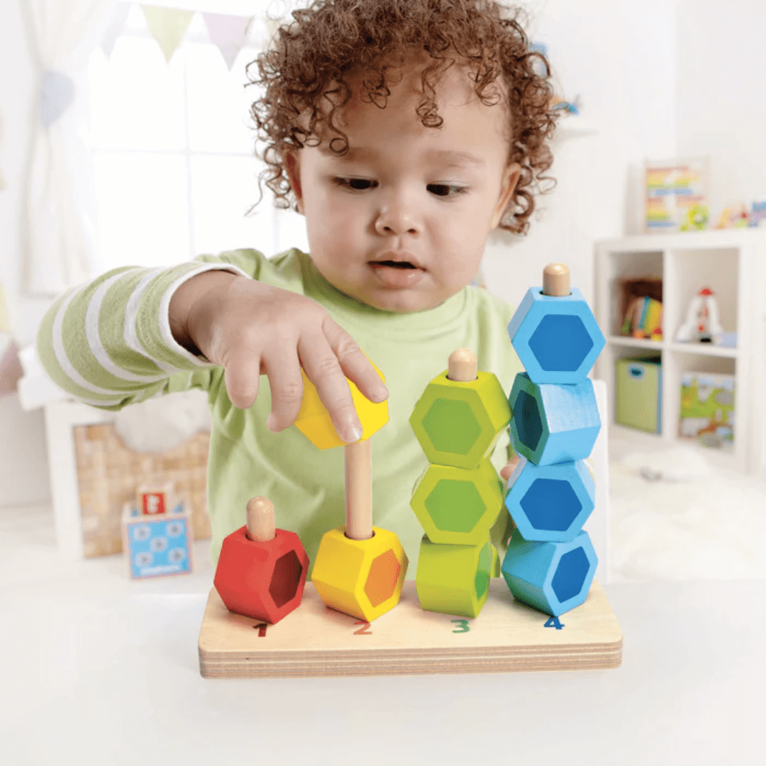 Little-Boy-Stacking-With-Hape-Counting-Stacker-Naked-Baby-Eco-Boutique