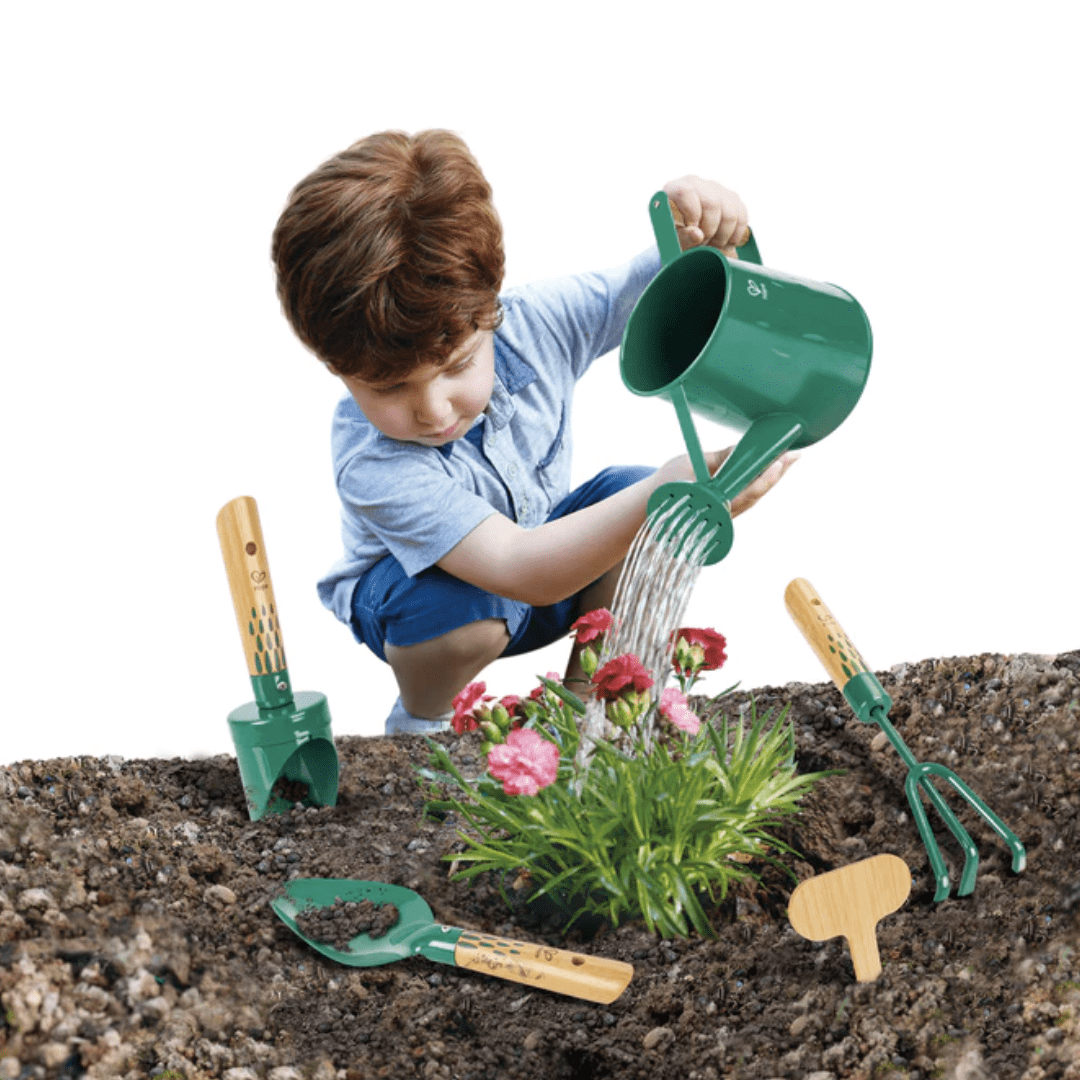 Little-Boy-Using-Hape-Garden-Tool-Set-Naked-Baby-Eco-Boutique